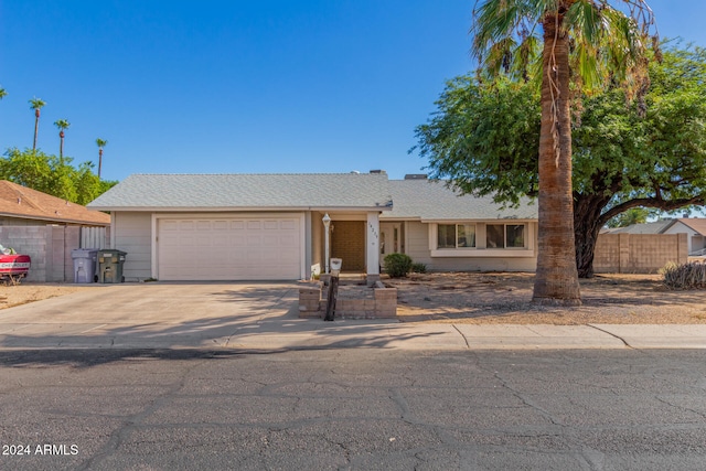 ranch-style home featuring a garage