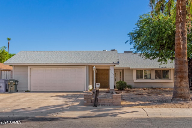 single story home with a garage