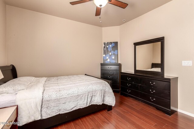 17153 W Gambit Trl, Surprise, AZ 85387 - bedroom with wood finished floors and a ceiling fan