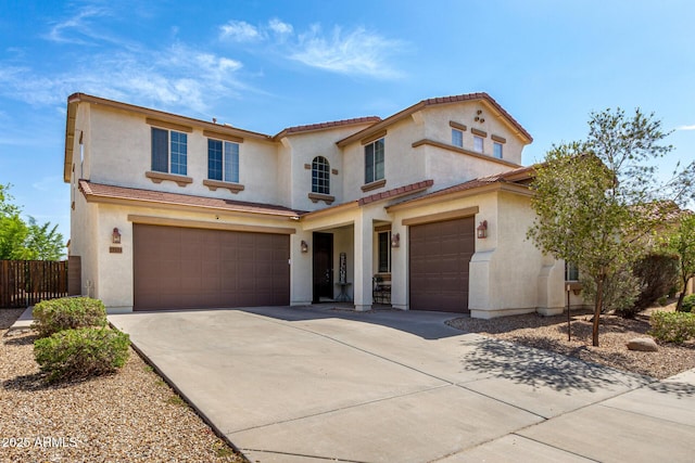 17153 W Gambit Trl, Surprise, AZ 85387 - mediterranean / spanish home with stucco siding, a garage, driveway, and a tile roof