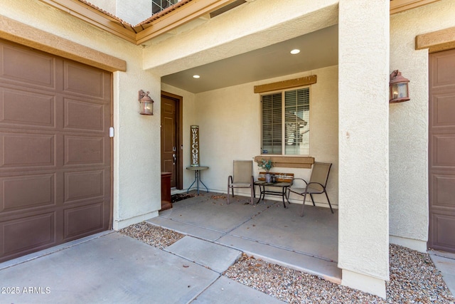 17153 W Gambit Trl, Surprise, AZ 85387 - view of exterior entry featuring a garage and stucco siding