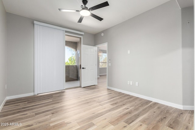 5303 N 7th St Unit 326, Phoenix, AZ 85014 - unfurnished bedroom featuring light wood-style floors, a ceiling fan, and access to exterior
