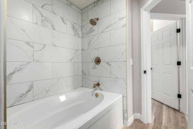 5303 N 7th St Unit 326, Phoenix, AZ 85014 - bathroom featuring wood finished floors and shower / bath combination