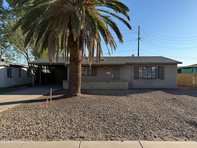 view of front of home with a carport