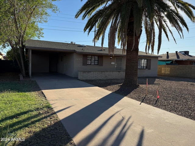 ranch-style house with a carport