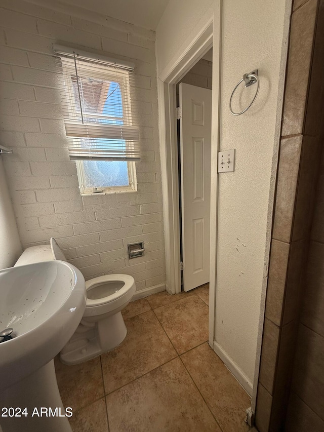 bathroom featuring tile patterned floors and toilet