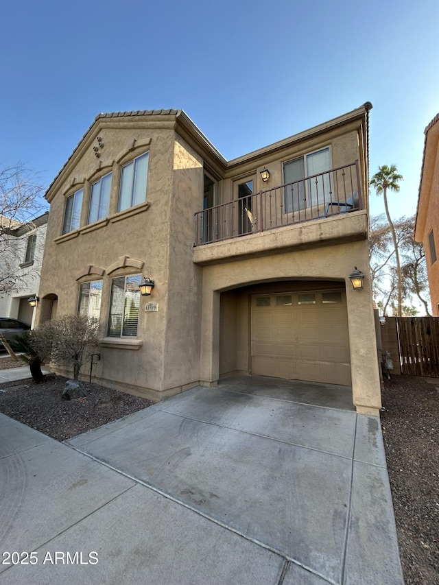 view of front of home featuring a garage and a balcony