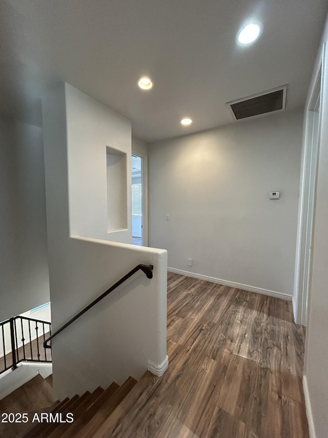 hall with dark hardwood / wood-style floors