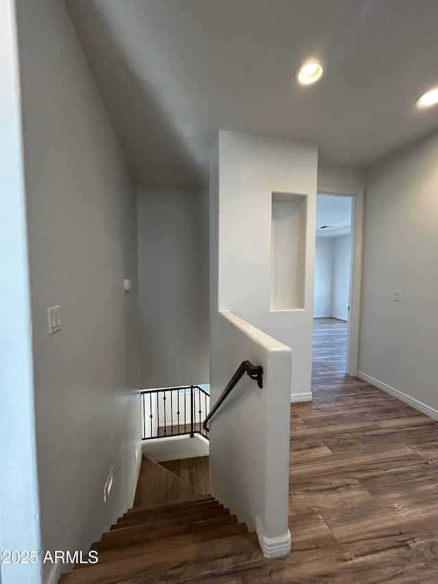 stairway featuring hardwood / wood-style floors