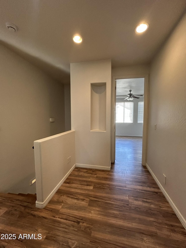 corridor featuring dark hardwood / wood-style flooring