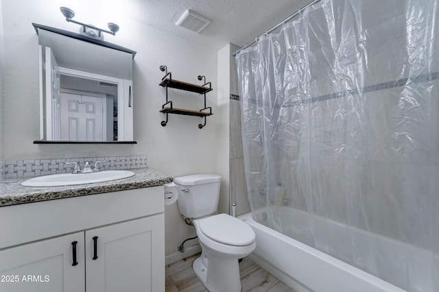 full bath with visible vents, toilet, a textured ceiling, shower / tub combo, and vanity