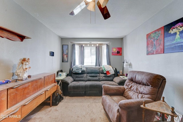 carpeted living room featuring ceiling fan