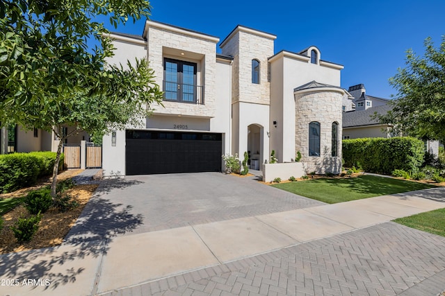 24905 S 206th Pl, Queen Creek, AZ 85142 - view of front of house with stone siding, decorative driveway, an attached garage, and stucco siding