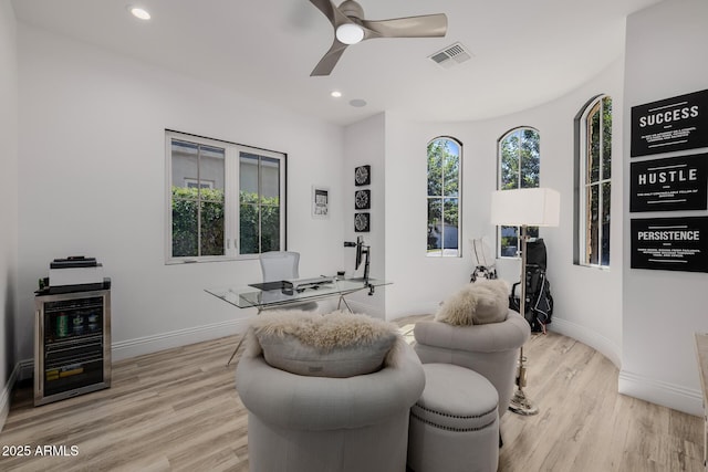24905 S 206th Pl, Queen Creek, AZ 85142 - living area featuring wine cooler, light wood-style flooring, a ceiling fan, baseboards, and recessed lighting