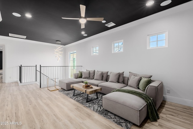 24905 S 206th Pl, Queen Creek, AZ 85142 - living area featuring plenty of natural light, wood finished floors, crown molding, baseboards, and ceiling fan