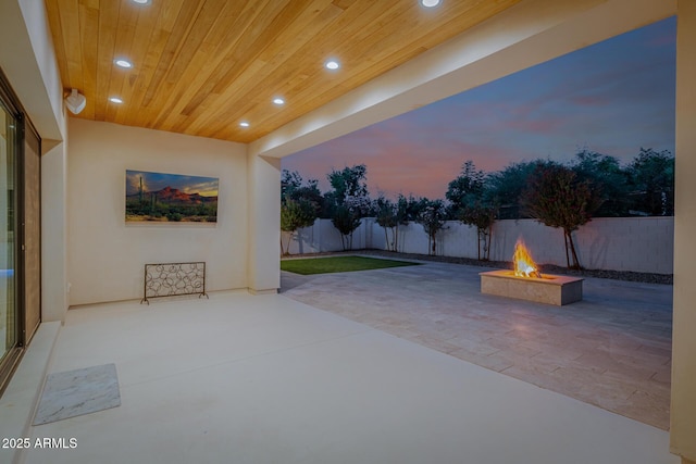 24905 S 206th Pl, Queen Creek, AZ 85142 - patio terrace at dusk with an outdoor fire pit, a patio, and a fenced backyard