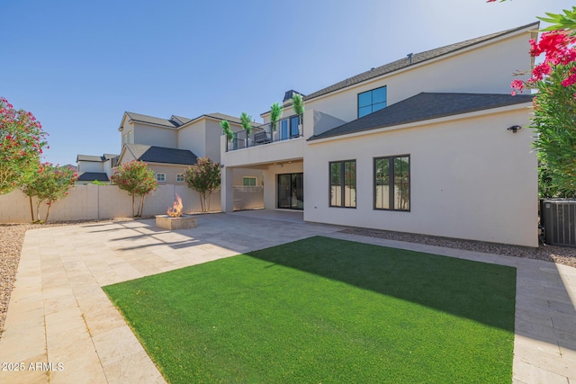24905 S 206th Pl, Queen Creek, AZ 85142 - rear view of property featuring stucco siding, a balcony, a patio area, a fire pit, and cooling unit