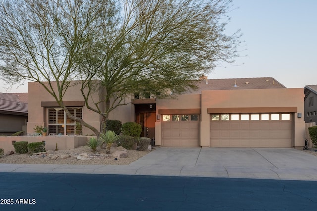 southwest-style home with a garage