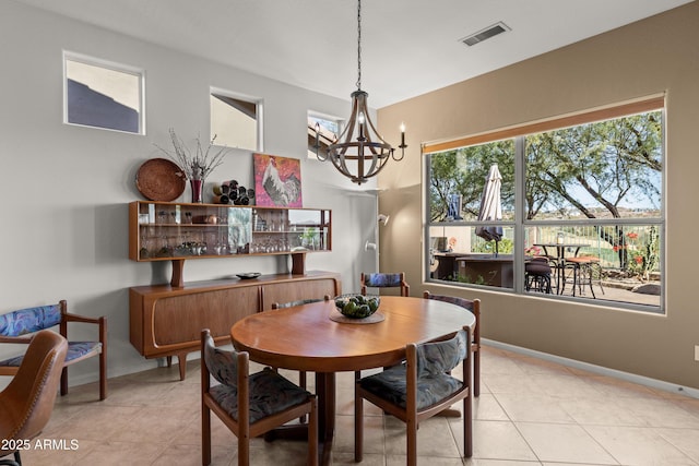 dining space featuring a chandelier and light tile patterned flooring