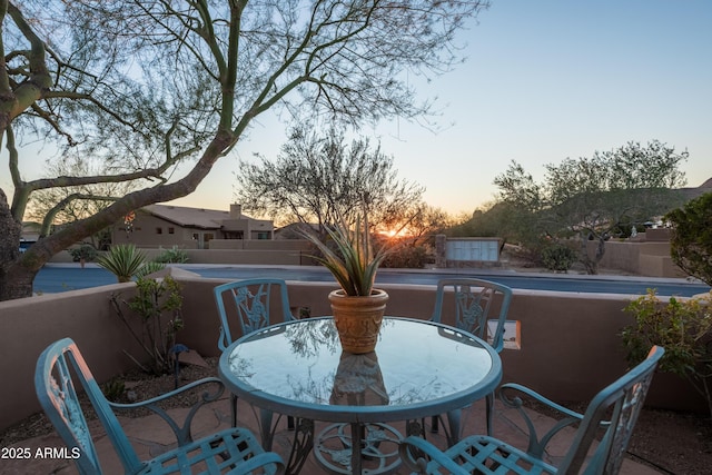 view of balcony at dusk