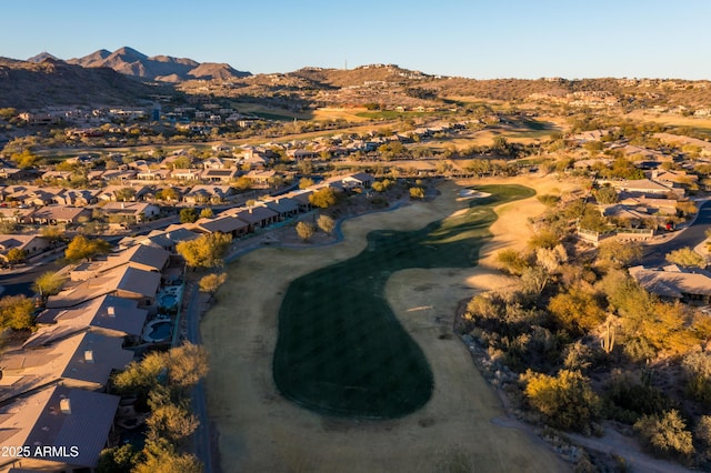 birds eye view of property with a mountain view