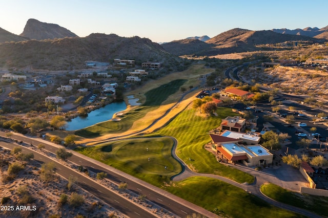 birds eye view of property featuring a water and mountain view