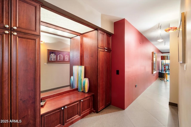 corridor featuring light tile patterned floors