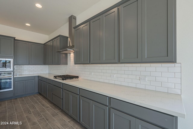 kitchen with gray cabinets and appliances with stainless steel finishes