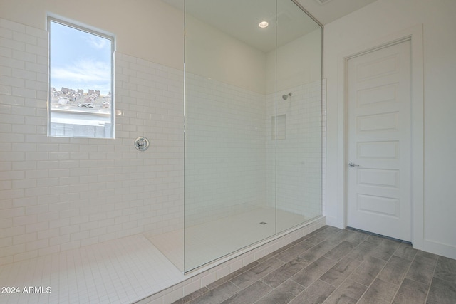 bathroom with a tile shower