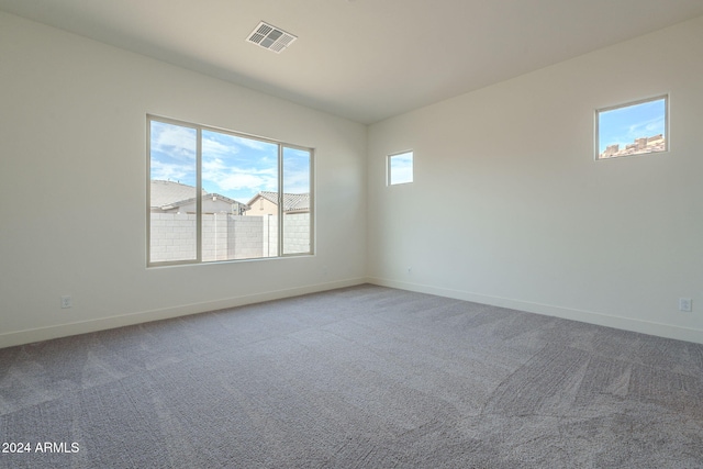 unfurnished room featuring carpet