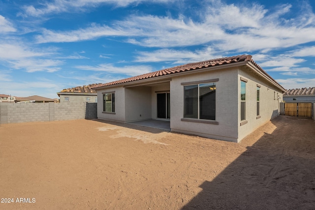 back of house featuring a patio