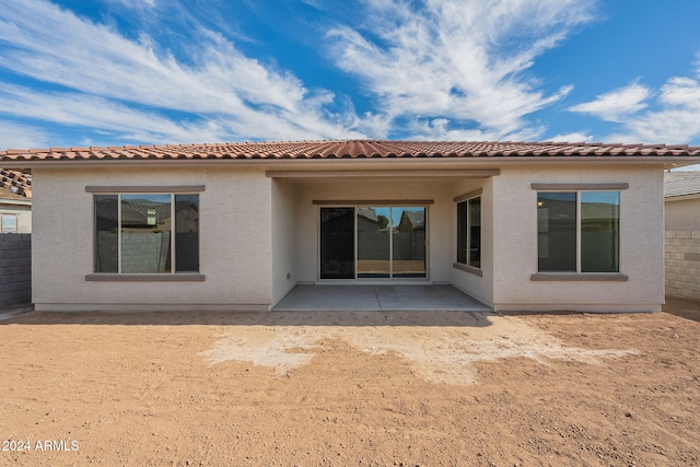 rear view of property featuring a patio