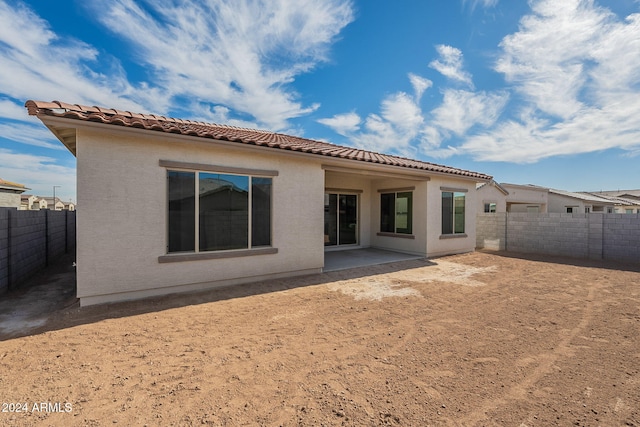 rear view of property featuring a patio