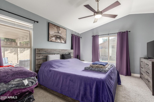 bedroom featuring vaulted ceiling, light colored carpet, and ceiling fan