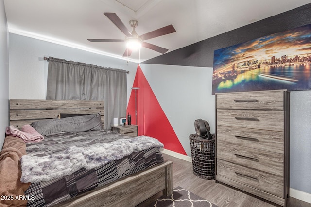 bedroom featuring hardwood / wood-style floors and ceiling fan