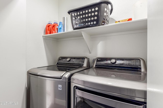 laundry room featuring washer and clothes dryer