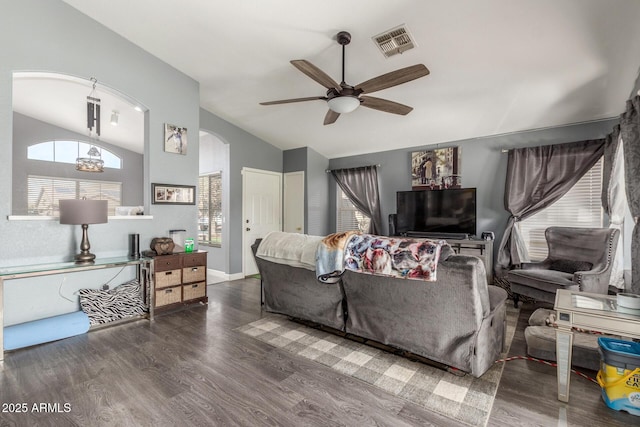 living room with vaulted ceiling, dark wood-type flooring, and ceiling fan