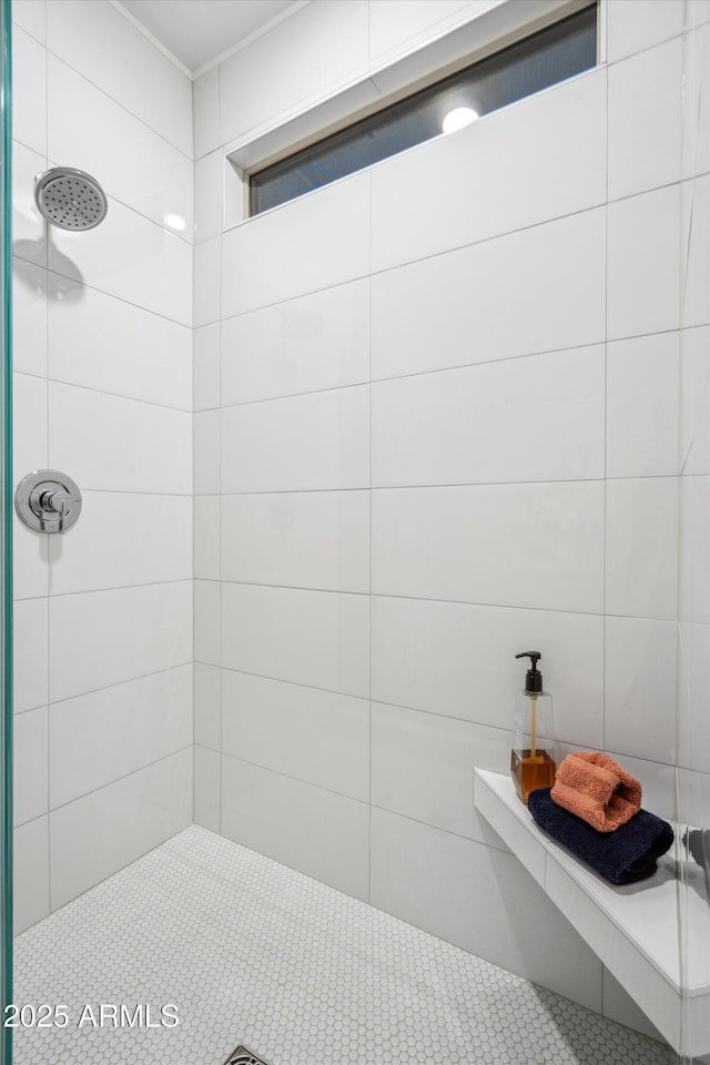 bathroom with a tile shower