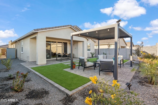 back of house featuring a patio area and an outdoor hangout area