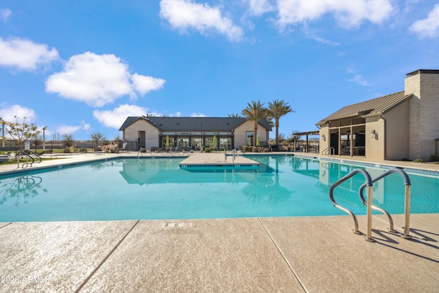 view of swimming pool with a patio