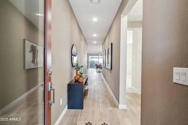 hallway featuring light hardwood / wood-style flooring