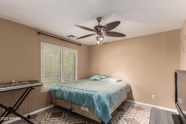 bedroom with light tile patterned floors, ceiling fan, visible vents, and baseboards