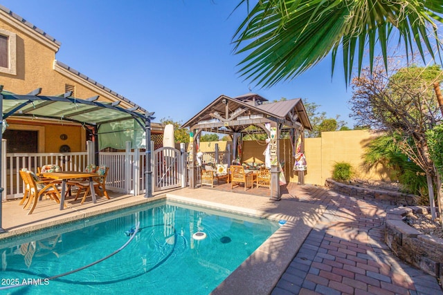 view of swimming pool with a fenced in pool, a patio, a gazebo, a pergola, and a fenced backyard