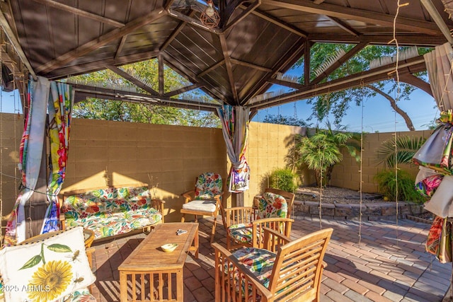 view of patio / terrace with a gazebo and a fenced backyard