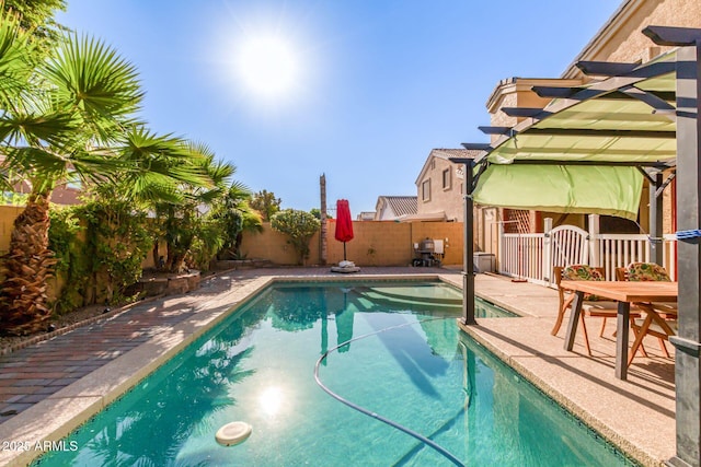 view of swimming pool featuring a patio area, a fenced backyard, a fenced in pool, and a pergola