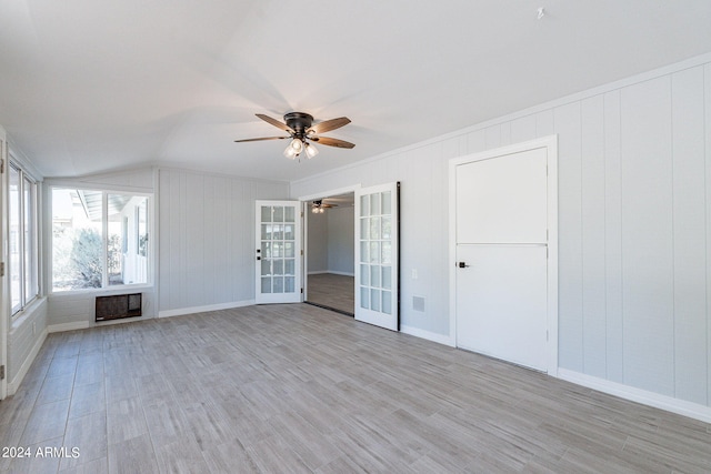 unfurnished bedroom with lofted ceiling, ceiling fan, and light hardwood / wood-style floors