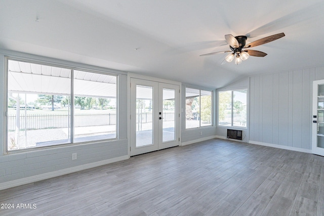 spare room with a healthy amount of sunlight, ceiling fan, and light hardwood / wood-style floors