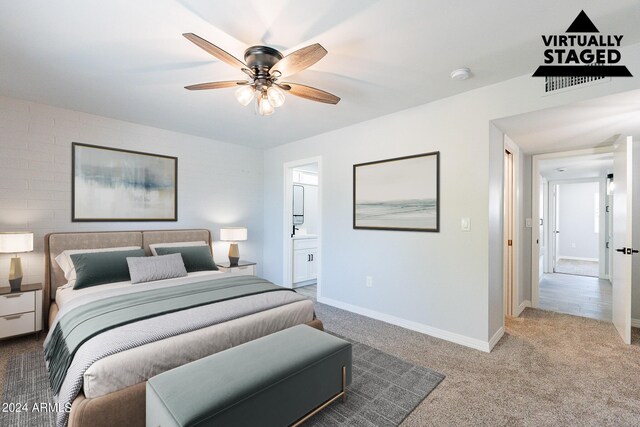 carpeted bedroom featuring ceiling fan and connected bathroom