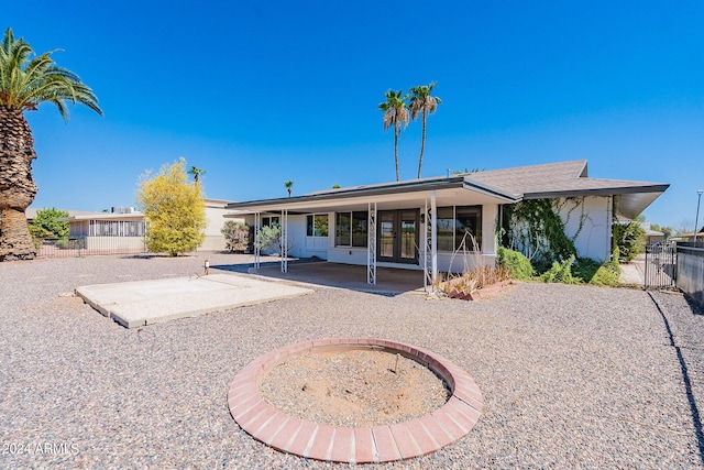 rear view of property featuring a patio