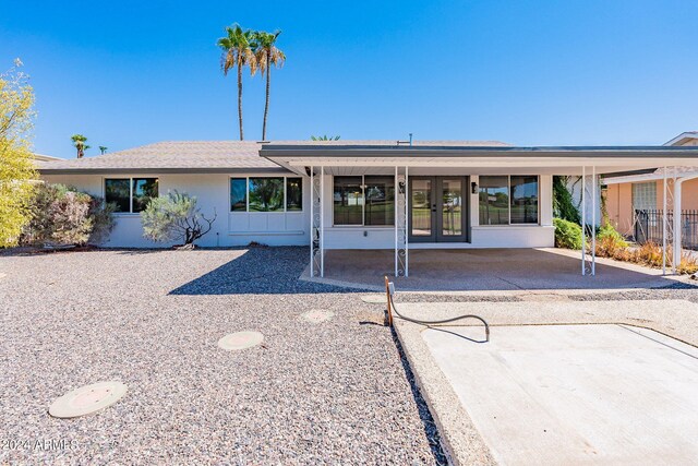 back of property featuring a patio area